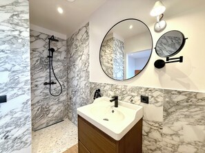 Shower, hair dryer, towels, soap