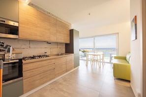 Deluxe Apartment, Sea View | Private kitchen | Fridge, microwave