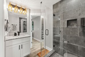 Shower, hair dryer, towels, shampoo