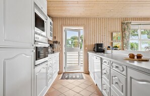 Fridge, stovetop, dishwasher, coffee/tea maker