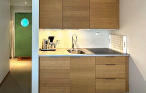 Fridge, dishwasher, coffee/tea maker, cookware/dishes/utensils