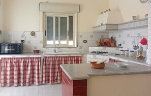 Fridge, stovetop, coffee/tea maker, cookware/dishes/utensils