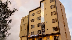 A multi-story building with a sign reading "HOTEL ELITE FORTUNE INN". - Hotel Elite Fortune Inn (Tirupati)