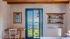 A bedroom with a wooden desk, a chair, a bed, and a bookshelf. - Alepou House - Gorgeous scenery (Aliki)