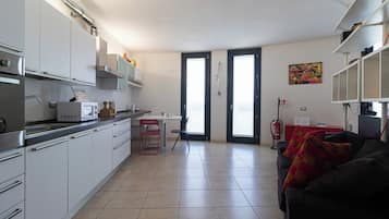 Apartment (1 Bedroom) | Living area | 32-inch Smart TV with cable channels