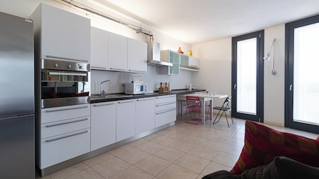 Apartment (1 Bedroom) | Living area | 32-inch Smart TV with cable channels