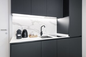 Fridge, microwave, stovetop, coffee/tea maker