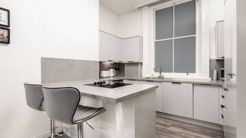 Microwave, stovetop, kitchen island
