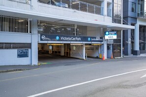 A parking garage entrance with a sign for Victoria Car Park and a cardholders entry. - Cosy CBD Loft Walk to Dining+Shopping Zodiak Stays (Auckland)