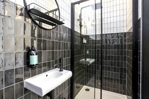 Shower, eco-friendly toiletries, hair dryer, towels