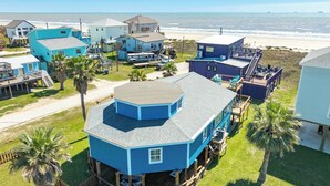 A coastal property with multiple houses, a dock, and a beach view. - Seabreeze Oasis - Beachy Days, Starry Nights! (Surfside Beach)