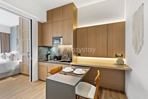Apartment, 1 Bedroom, Kitchen | Living area | Flat-screen TV - Calira by Kozystay - Nusa Dua (Nusa Dua)