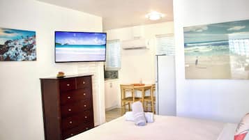 1 bedroom, desk, iron/ironing board, travel crib