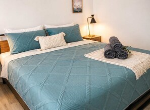 1 bedroom, desk, iron/ironing board, travel crib