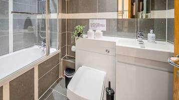 Shower, hair dryer, towels, shampoo
