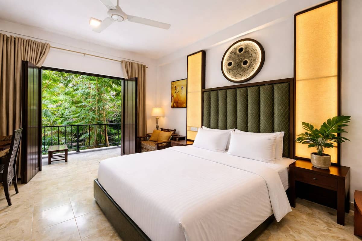 Deluxe Double Room, Balcony, Pool View | Minibar, in-room safe, desk, free WiFi