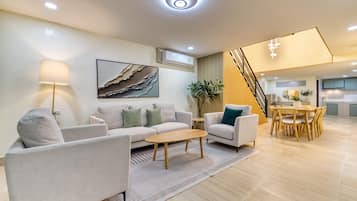 Four-Bedroom Apartment with Kitchen | Living area | LED TV