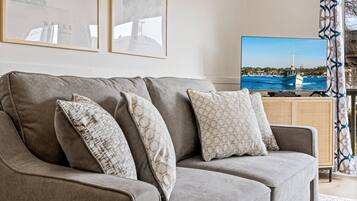 Condo, 1 Queen Bed with Sofa bed, Balcony, Garden View (Serenity by the Sea) | Living area | 42-inch flat-screen TV with digital channels