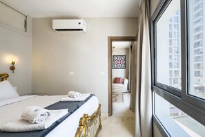 Departamento básico | 1 habitación, tabla de planchar con plancha y ropa de cama 