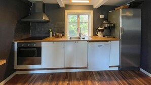 A compact kitchen with a dishwasher, a stove, a sink, and a refrigerator. - 2 bedroom nice home in Huaröd (Huaröd)