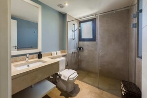 A modern bathroom with a glass-enclosed shower, a toilet, and a sink with a mirror above it. - Xuru Stays I Sundown Symphony 4mbdr Villa @ Joubal El Gouna (El Gouna)