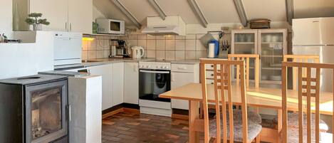 Fridge, stovetop, dishwasher, coffee/tea maker