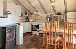 Fridge, stovetop, dishwasher, coffee/tea maker