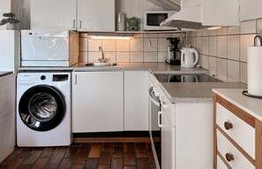 Fridge, stovetop, dishwasher, coffee/tea maker