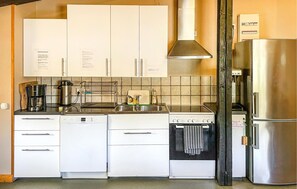 Fridge, stovetop, dishwasher, coffee/tea maker