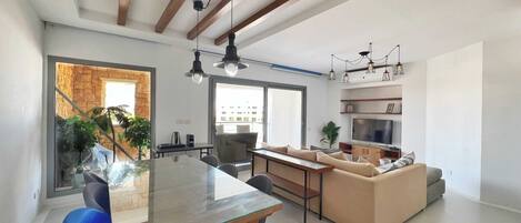 Basic Apartment | Living area | 55-inch Smart TV with cable channels