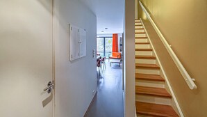 A hallway leading to a dining area with a staircase. - 2 bedroom pet friendly apartment in Søgne (Søgne)