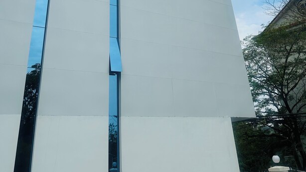 A modern building with a sign reading "Aure Residence Hotel". - Aure Residence Hotel (Sihanoukville)