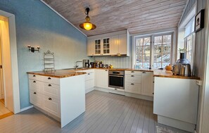 Fridge, dishwasher, coffee/tea maker, cookware/dishes/utensils