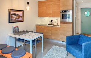 Fridge, dishwasher, coffee/tea maker, dining tables