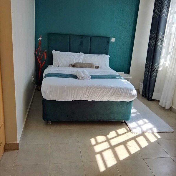 1 غرفة نوم ومكواة/لوح كي وواي فاي وملاءات أسرّة