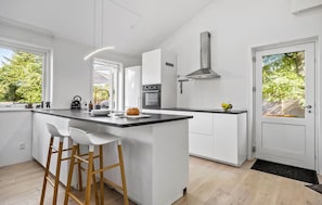 Fridge, stovetop, dishwasher, coffee/tea maker