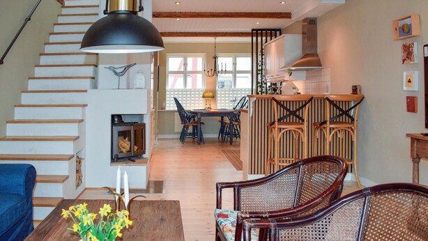 A spacious living area with a staircase, a dining table, and a kitchen area. - 2 bedroom lovely home in Ystad (Ystad)