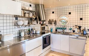 Fridge, stovetop, dishwasher, coffee/tea maker