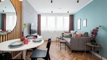 Comfort Apartment, City View | Living area | 50-inch Smart TV with cable channels, Netflix, streaming services