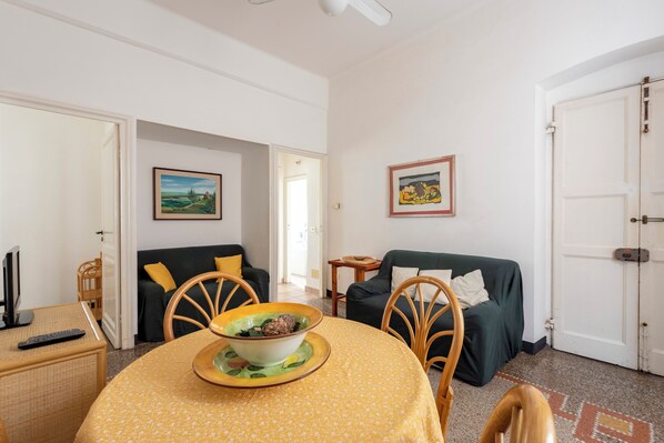 Apartment, 2 Bedrooms | Living area | 32-inch flat-screen TV with cable channels