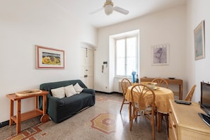 Apartment, 2 Bedrooms | Living area | 32-inch flat-screen TV with cable channels