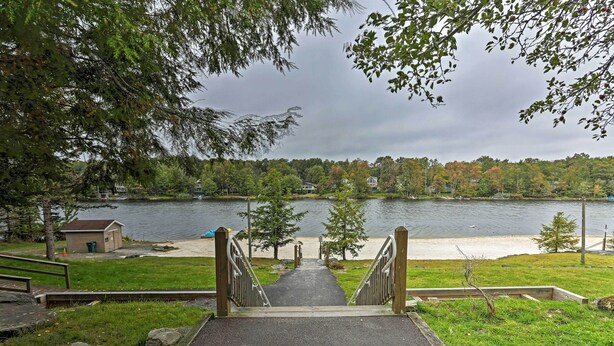 A pathway leading to a beach with a view of a lake and trees. - 3 Mi to Tobyhanna State Park: Home w/ Serene Deck! (Tobyhanna)