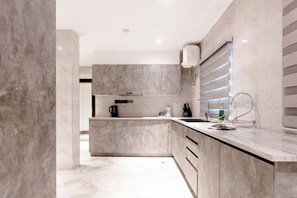 Economy Apartment, Balcony, City View | Private kitchen | Fridge - The Vattern Apartments (Abuja)