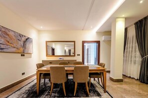 Economy Apartment, Balcony, City View | Dining room