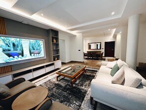 Economy Apartment, Balcony, City View | Living area - The Vattern Apartments (Abuja)