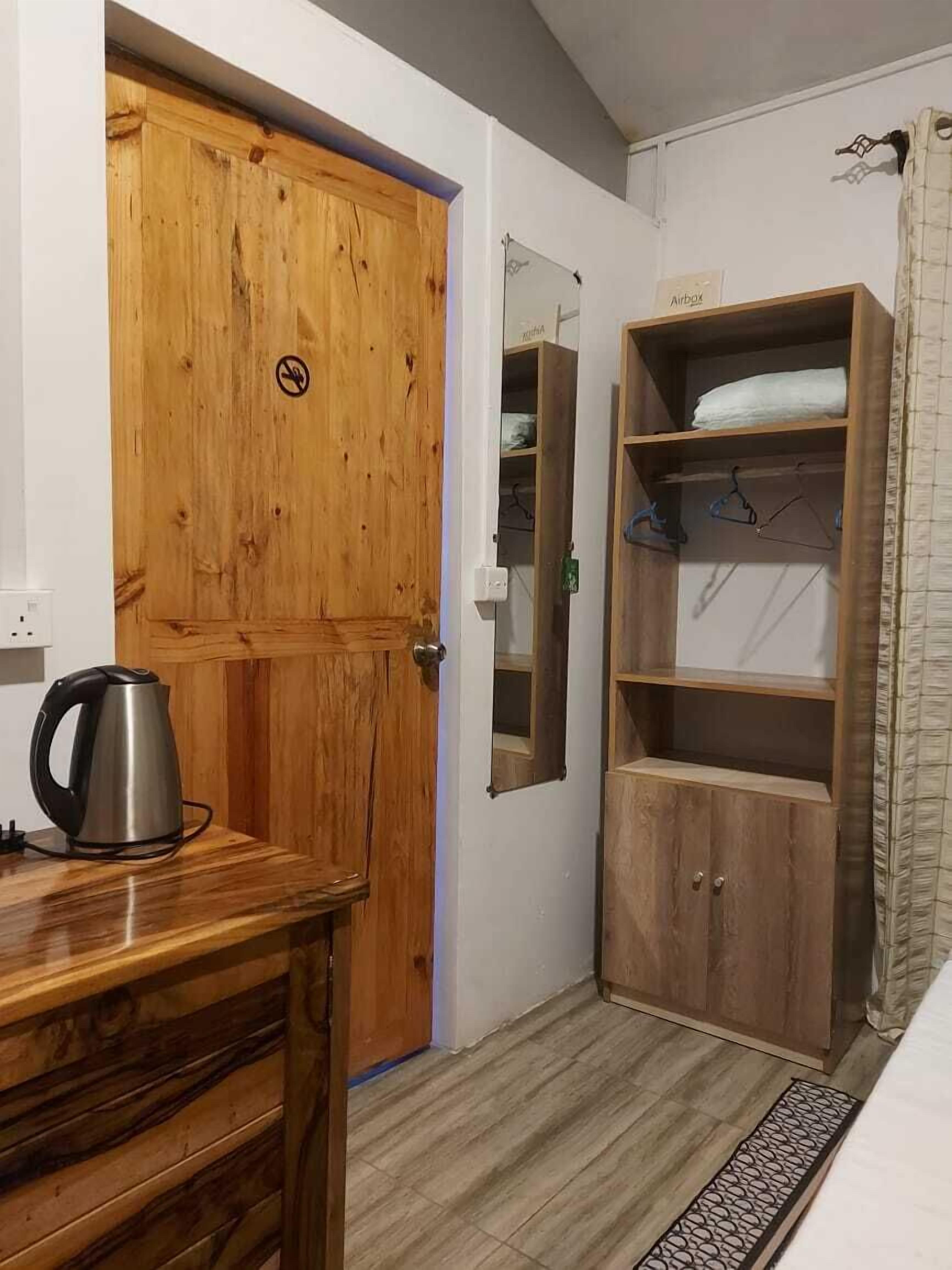 Desk, blackout curtains, soundproofing, iron/ironing board