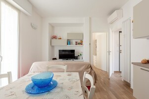 Family Apartment, City View | Living area | 43-inch flat-screen TV with digital channels, TV