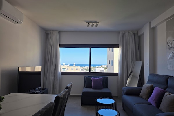 Family Apartment, Partial Sea View | Living area | 35-inch Smart TV with digital channels