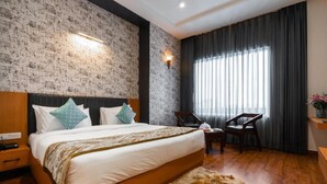 A bedroom with a large bed, a wooden headboard, a fur rug, a chair, and a nightstand. - Xenious Micro (Amritsar)