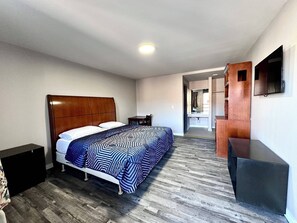 Deluxe eenpersoonskamer | Een bureau, een laptopwerkplek, gratis wifi